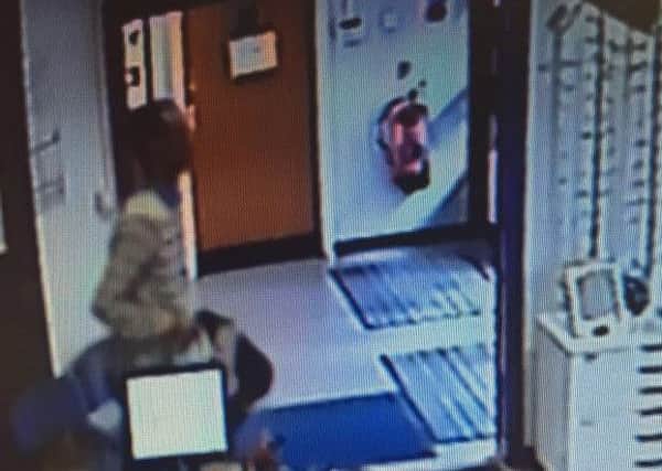 A man from CCTV who is suspected of stealing a charity box from Darnall Health Centre on York Road