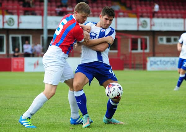 Ched Evans holds off a defender (Pic: Craig Lamont)
