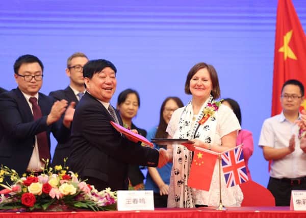 Sheffield Council leader Julie Dore signs a 60-year partnership deal with Wang Chunming, chairman and president of Chinese firm Sichuan Guodong Construction Group, in Sheffield's sister city Chengdu.