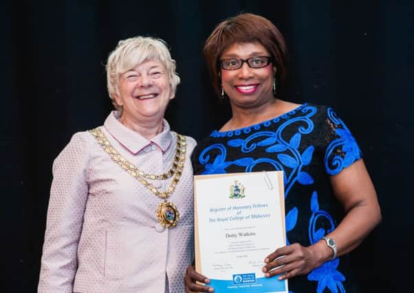 Sheffield midwife Dotty Watkins receives a an Honorary Fellowship from the Royal College of Midwives president professor Lesley Page. Photo: Rafael Bastos