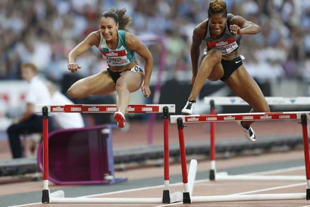 Great Britain's Jessica Ennis-Hill (left) and Canada's Phylicia George in the women's 100m hurdles in London