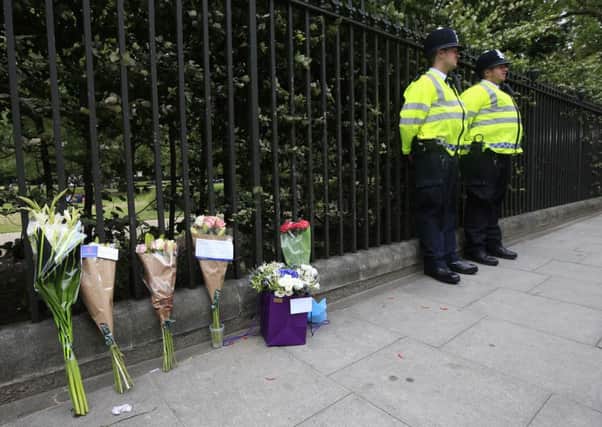 Floral tributes rest against railings near the scene of a fatal stabbing in Russell Square, London, after a 19-year-old man was arrested on suspicion of murder after a woman was killed and five people injured in a knife rampage in central London. PRESS ASSOCIATION Photo. Picture date: Thursday August 4, 2016. Counter-terrorism officers are supporting the investigation into the attack, although Scotland Yard said it was focusing its lines of inquiry on mental health. See PA story POLICE Attack. Photo credit should read: Jonathan Brady/PA Wire