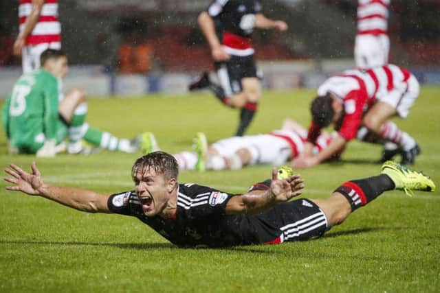 Jamie Ward celebrates netting the winner for Nottingham Forest against Rovers