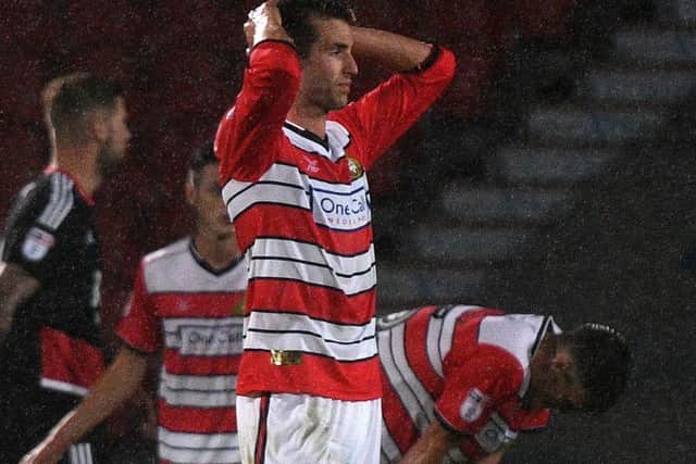 Matty Blair puts his head in his hands after Rovers concede a late goal to exit the EFL Cup at the hands of Nottingham Forest