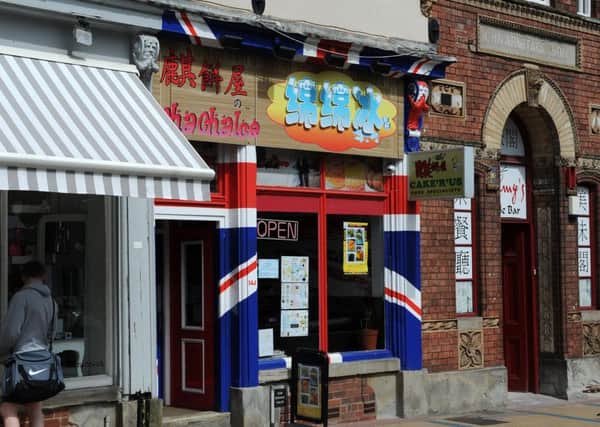 Cake R Us, Devonshire Street, are facing legal action from the council over the union flag paintwork on the building. Picture: Andrew Roe