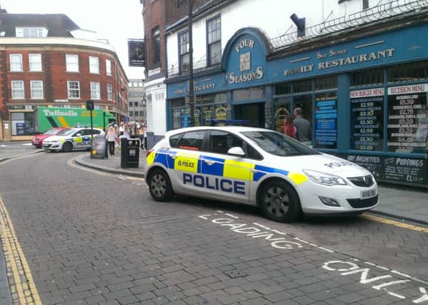 Police prevent traffic from coming on to Printing Office Street, Doncaster, after a male pedestrian was involved in a collision with a taxi on the corner of Printing Office Street and Priory Place