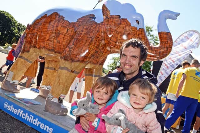 John Breakell, pictured with daughters Amelia, three and Lexi, two, by the Star's Elephant, 'Eli'. Picture: Marie Caley NSST Star Elephant MC 5