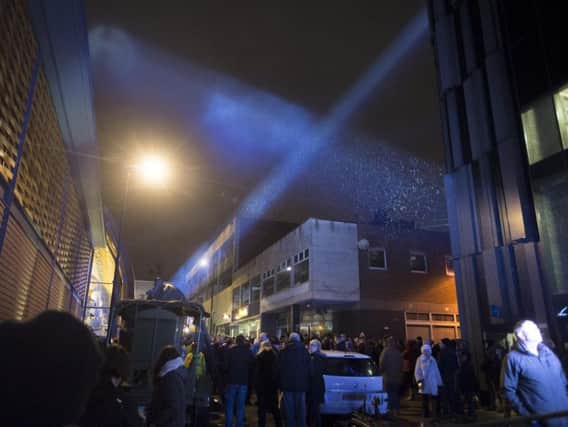 Searchlights sweep the sky at an event at the Moor Market last December to commemorate the 75th anniversary of the Sheffield Blitz