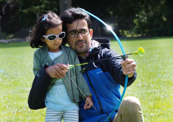 Summer of Sport activities at National Trust Peak District properties: Maryam Kagzi and dad Mohammed try their hand at archery
