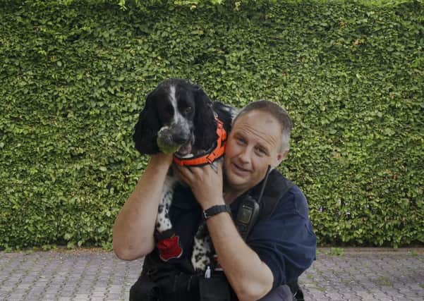 Watch Manager Dave Coss and Dexter, the FI Dog