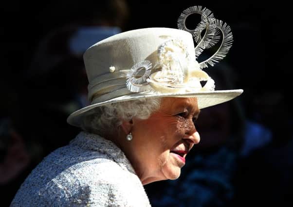 Queen Elizabeth II at the gates at Balmoral. Pic: PA