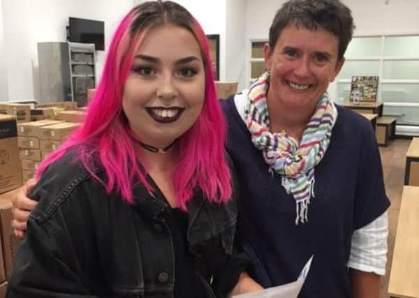Chapeltown Academy sixth formers collect their A-level results. Kirsty Joelson with Biology teacher Jackie Skeer.