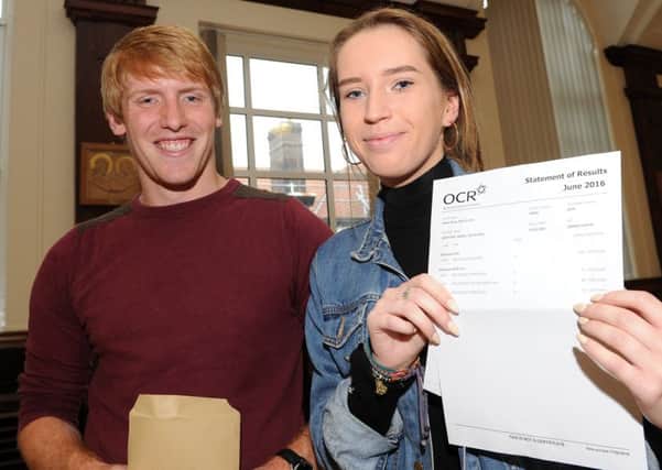 Isabel Griffiths, Notre Dame High School celebrates her results with her teacher Josh Neal. Isabel achieved an A in Philosophy and Ethics and B's in English Language and History and is going to Newcastle University to study Philosophy. Picture: Andrew Roe