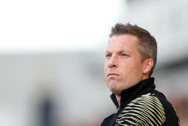 Millwall manager Neil Harris watched his side lose in midweek