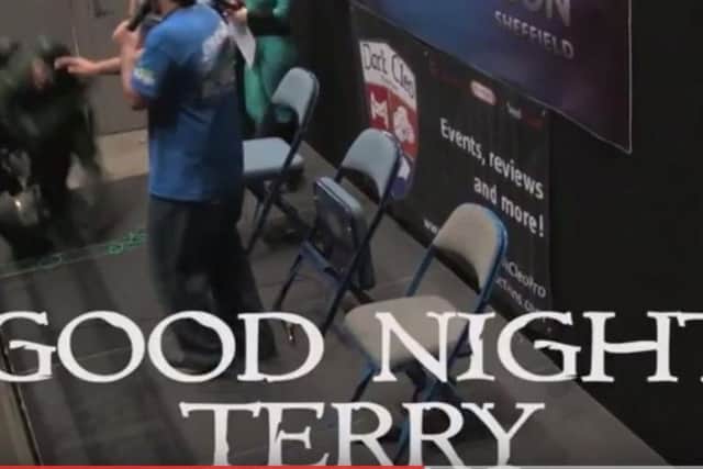 Terry (left) goes down as he prepares to enter the stage. (Photo: YouTube/Dark Cleo Productions).