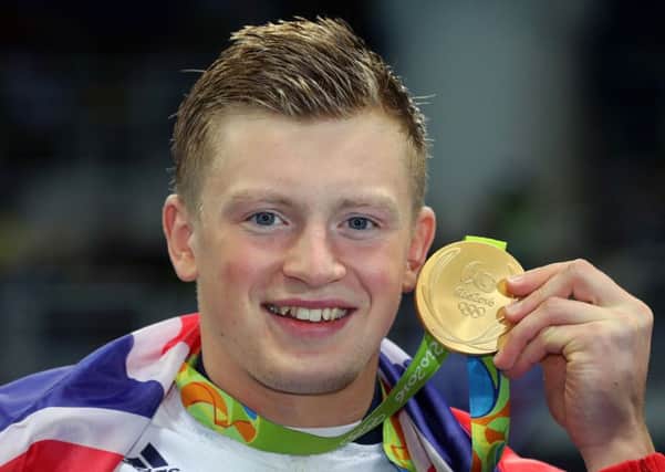Great Britain's Adam Peaty with his gold medal following the Men's 100m breaststroke final at the Maria Lenk Aquatics Centre during the second day of the Rio Olympics Games, Brazil. Photo: Owen Humphreys/PA Wire