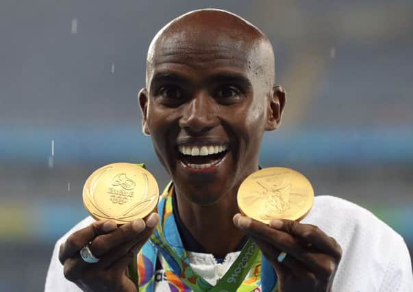 Mo Farah with his Rio gold medals for victory in the Men's 5000m and 10000m. Photo: Martin Rickett/PA Wire.