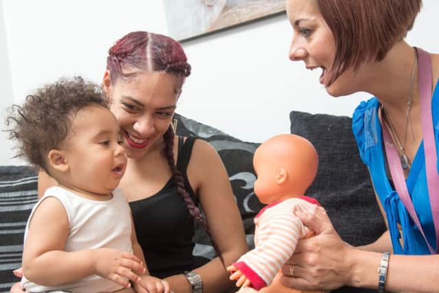 Jody Hanson and her son Saint Hezekiah Trotman-Hanson with Helen Voyse who works as a Doula