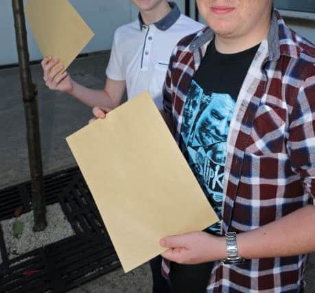 Jack Gascoigne (l) and Samuel Elliott of Handsworth Grange Community Sports College celebrate receiving their GCSE Results. Picture: Andrew Roe