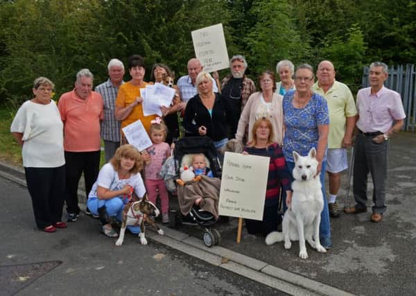 Joan and Bill Weir, Neighbourhood watch, pictured with residents from Ivor Grove and Evanston Gardens as they protest against plans to build 60 new homes on their doorsteps. Picture: Marie Caley NDFP Protest MC 2