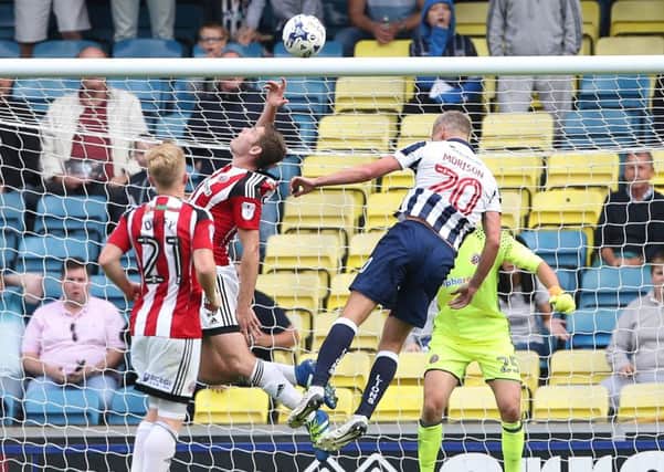 Sheffield United's Jack OConnell handles the ball to concede a late penalty at Millwall