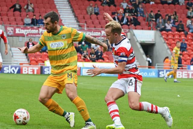 James Coppinger puts pressure on Yeovil's Alex Lawless