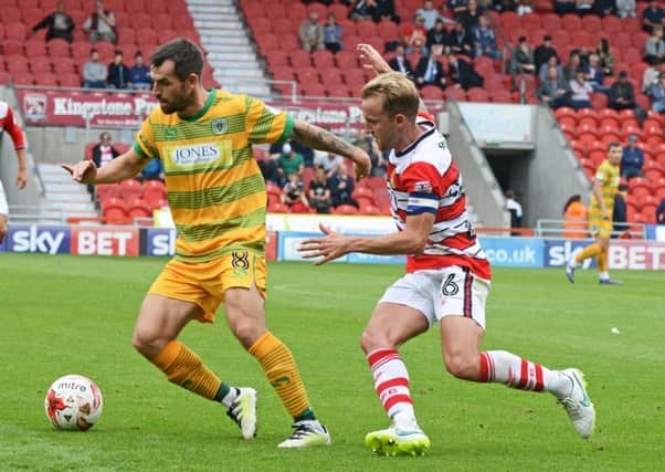 James Coppinger puts pressure on Yeovil's Alex Lawless