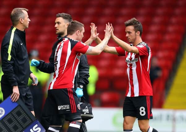 John Fleck of Sheffield Utd  replaces Stefan Scougall, who has been earning praise from Blades assistant Alan Knill