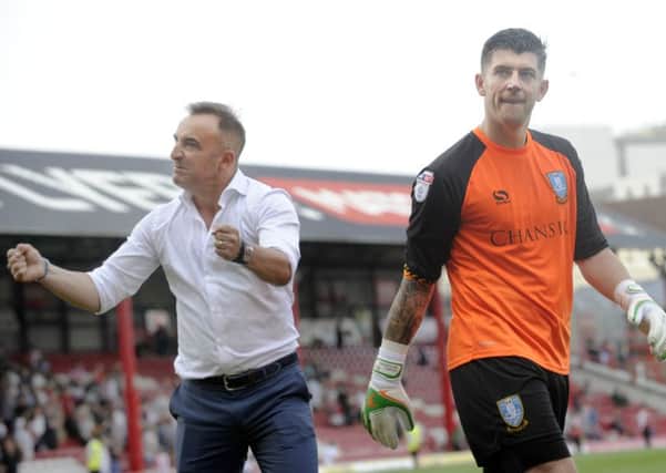 Carlos Carvalhal salutes Sheffield Wednesday supporters at Brentford along with goalkeeper Keiren Westwood