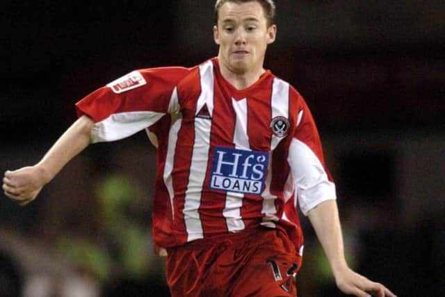 Alan Quinn in action for United