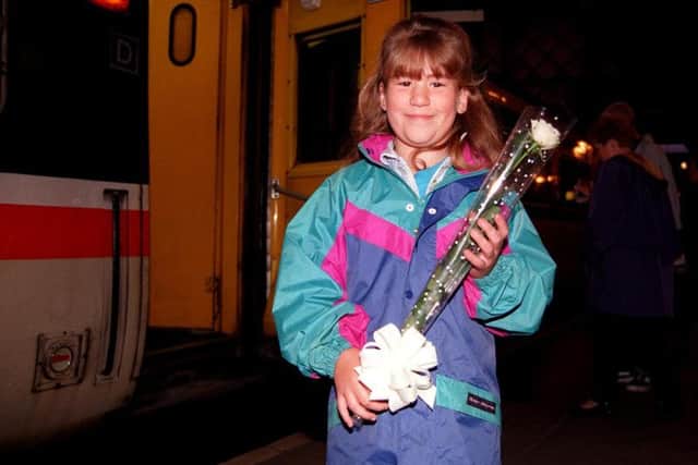 A young Diana fan prepares to set off from Sheffield station for her funeral in London.