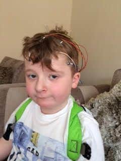 Benjamin Cherrill, aged seven, was laughed at by an employee because he had medical wires attached to his head.