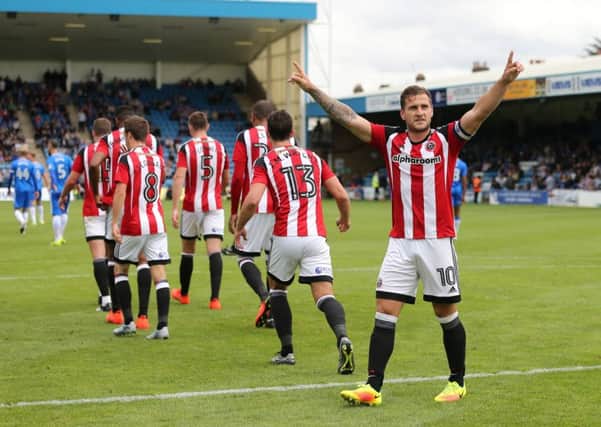 Sheffield United's Billy Sharp celebrates scoring his sides second goal during the League One match at the Priestfield Stadium