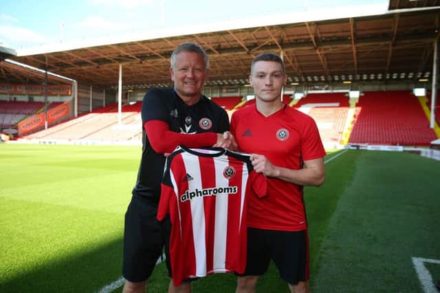 Chris Wilder, the manager of Sheffield United, welcomes Caolan Lavery to Bramall Lane 
Â©2016 Sport Image all rights reserved