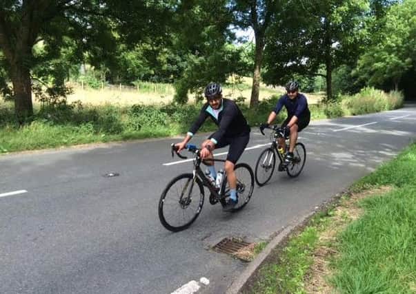 Two of the 'Lardy Lads' team members pedalling away.