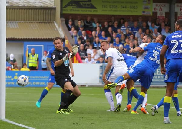 Wimbledon's Darius Charles puts through his own net to give Chesterfield the lead