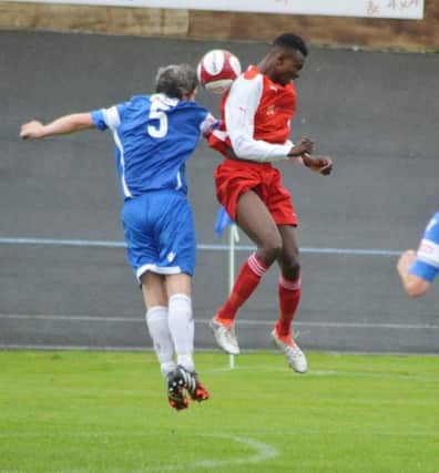 Stocksbridge striker Kudakwashe Muskwe, right, challenges for the ball in 3-1 win at Newcastle Town. Photo: Gillian Handisides