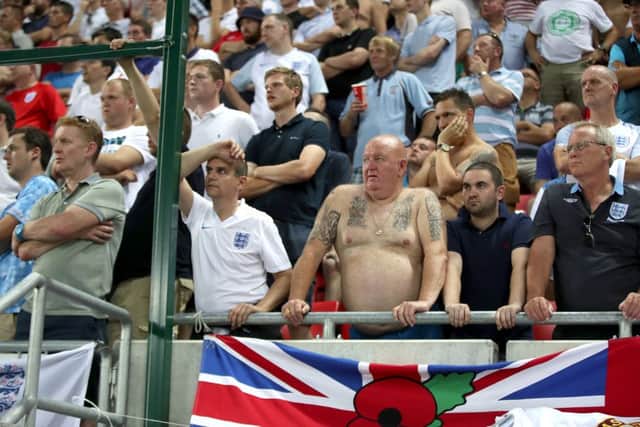 England fans watch in frustration from the stands during the 2018 FIFA World Cup Qualifying match at the City Arena, Trnava.
