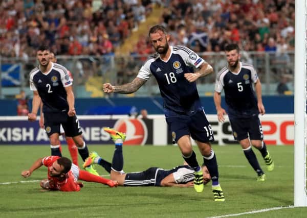 Scotland's Steven Fletcher celebrates scoring his side's fourth goal