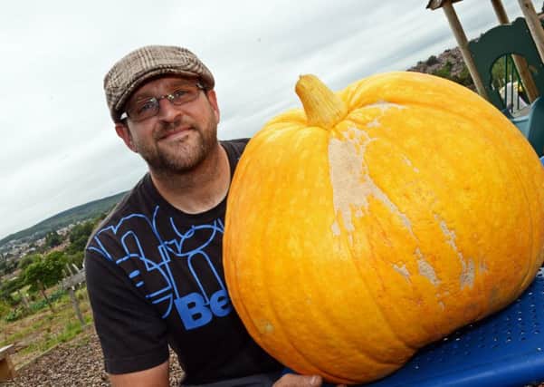 Sam Squires, pictured with his 80lb Big Max Pumpkin, grown on his Parson Cross allotment patch. Picture: Marie Caley NDFP Pumpkin MC 7
