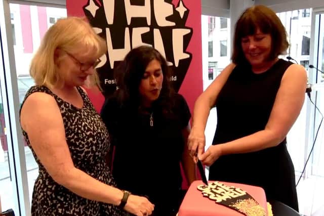 Off The Shelf team - left to right - Su Walker, Maria de Souza and Lesley Webster celebrate with 25th anniversary cake.