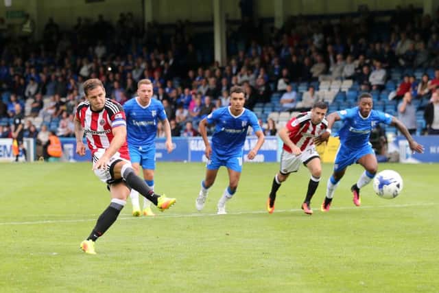 Sheffield United's Billy Sharp notches the penalty at Gillingham