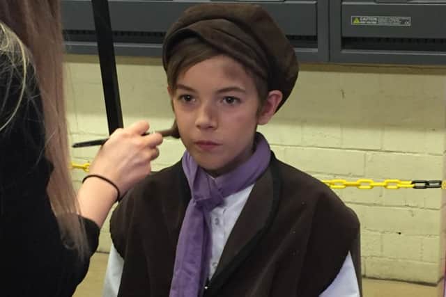 Reiss Ward performings as Oliver