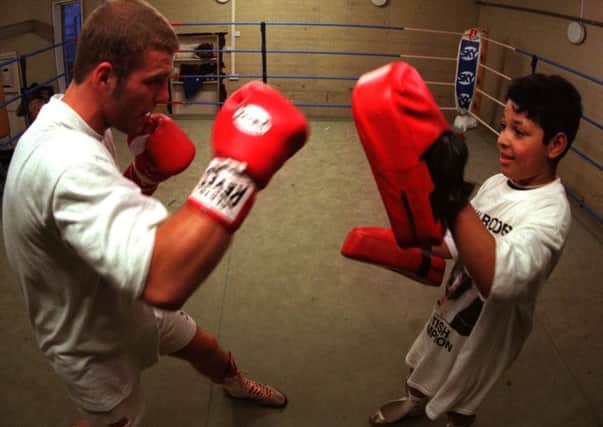 A 10 year old Kell Brook in training with Ryan Rhodes at the Wincobank gym.