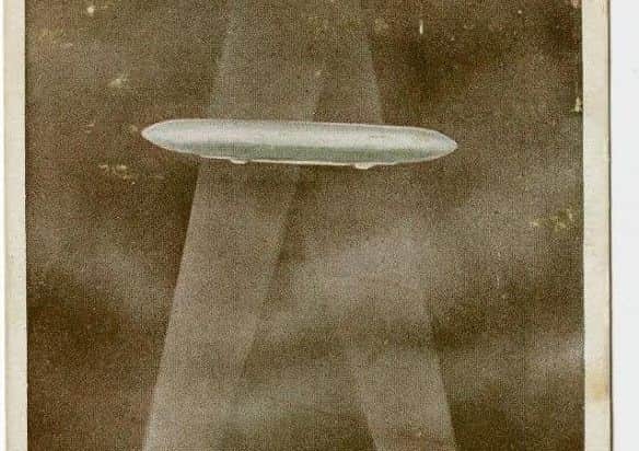 A postcard of a Zeppelin raid.