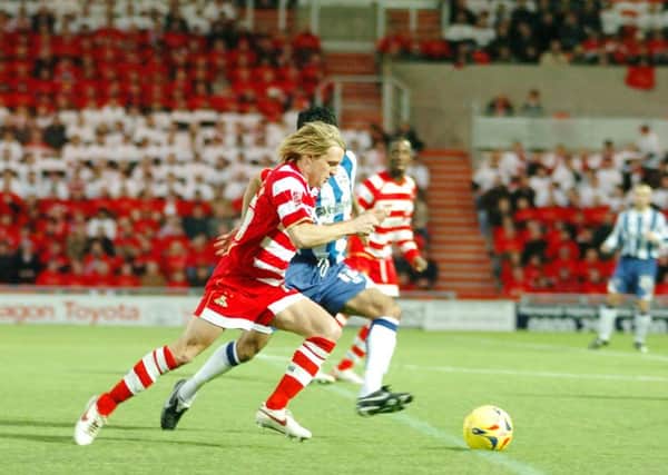 James Coppinger, pictured in action during the first game at the Keepmoat Stadium in 2007, is due to make his 500th appearance for Doncaster Rovers at Morecambe today.