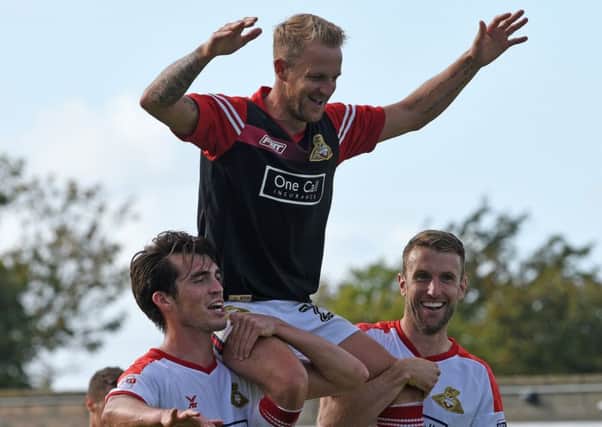 James Coppinger celebrates his 500th appearence for the club. Photo: Andrew Roe