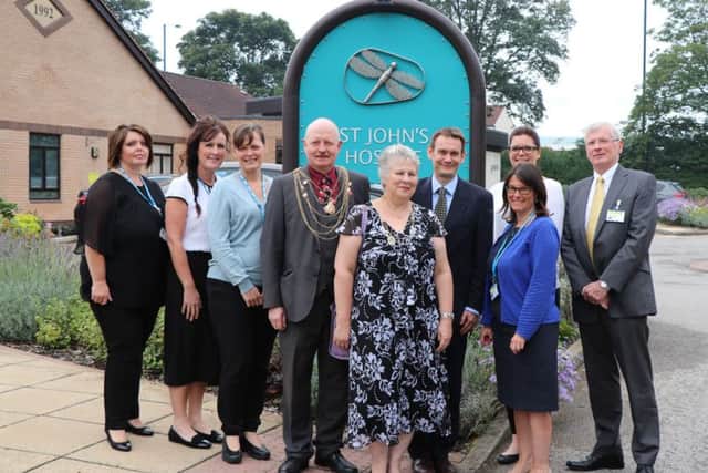 Doncaster St John's Hospice staff are pictured at the open day together with Civic Mayor of Doncaster, Cllr David Nevett (4th from left); Dr David Crichton, of Doncaster CCG (6th from left) and far right Lawson Pater, Chairman of RDaSH.