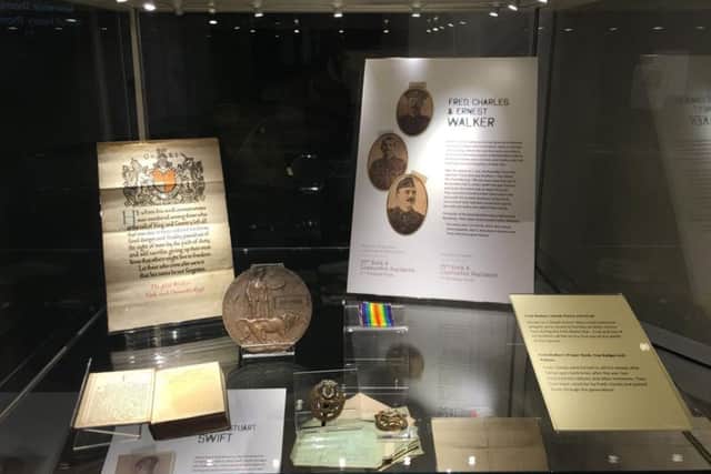 Stories Of The Somme tells the real life stories of the Barnsley Pals illustrated with family treasures like the death scroll, prayer book, Death Penny, cap badges and medal ribbon here belonging to tragic Fred Walker - he died with brothers Charles and Ernest on the first day of the battle 100 years ago.