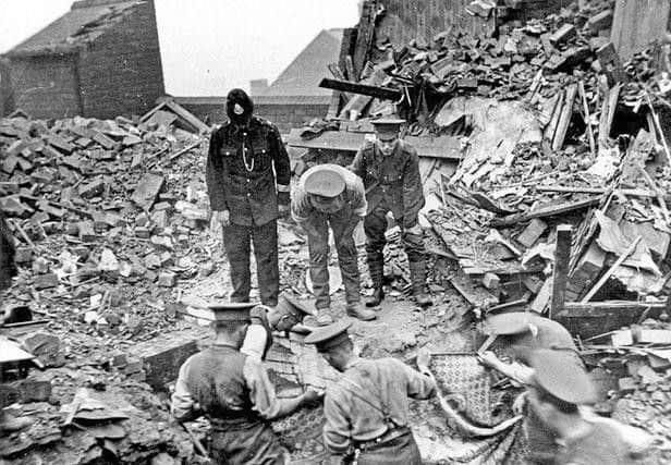 Rescuers searching the ruins in Cossey Road, Sheffield